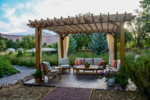 Outdoor deck ideas - patio set underneath pergola.