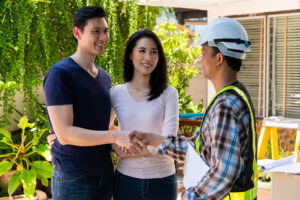 A family discussing preparing for home remodeling with a contractor.